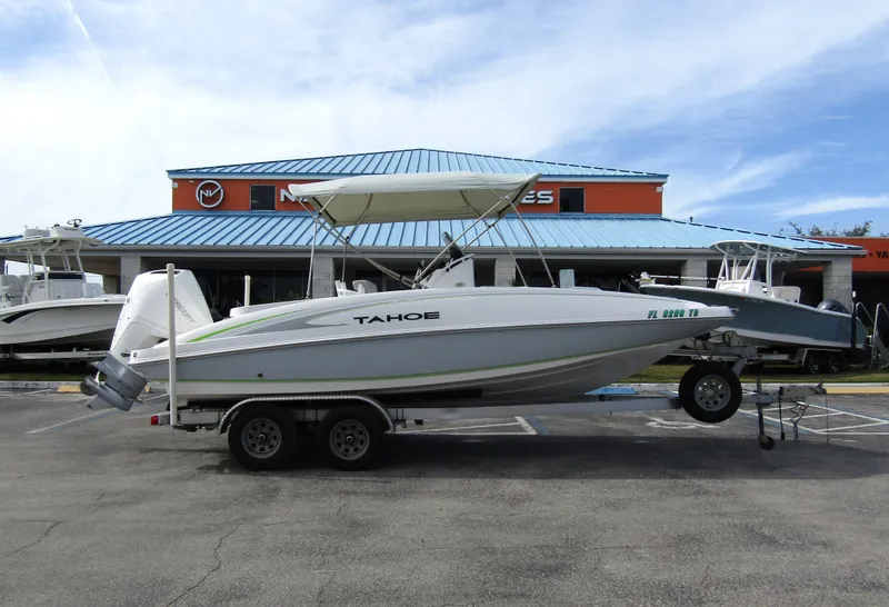 Slide: The Image of 2022 Tahoe 2150 CC boat on trailer in front of dealership. - 5