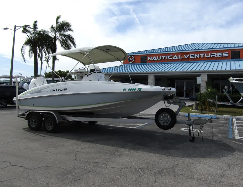 Slide: The Image of 2022 Tahoe 2150 CC boat on trailer at Nautical Ventures dealership. - 6