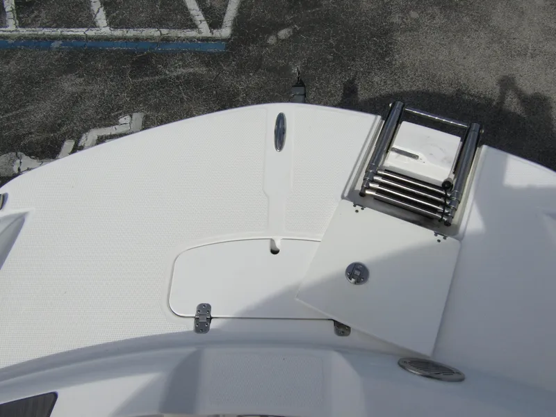 Slide: The Image of Tahoe 2150 CC 2022 boat deck with ladder and hatch, top view. - 9