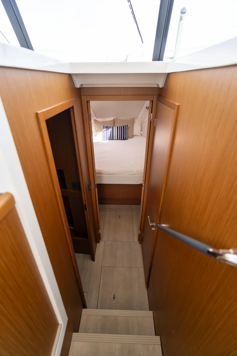 Slide: The Image of Interior view of 2023 Beneteau Swift Trawler 35, featuring cozy cabin and wooden finishes. - 11