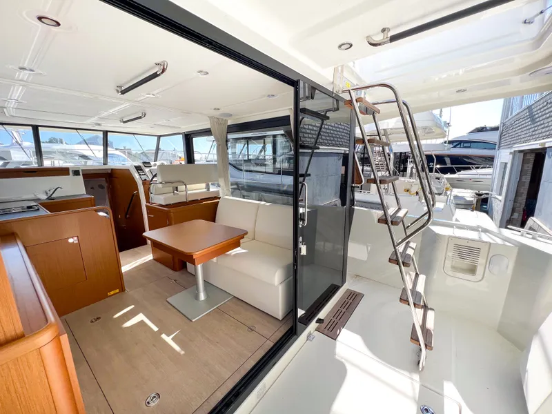 Slide: The Image of 2023 Beneteau Swift Trawler 35 interior with modern seating and dining area. - 20