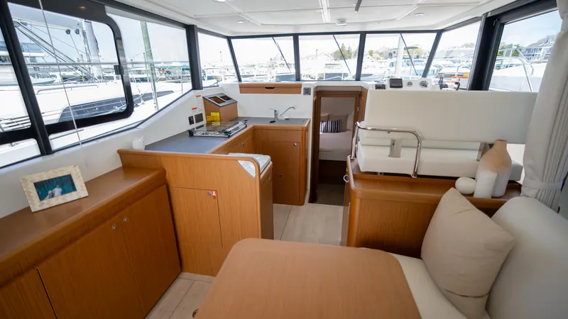 Slide: The Image of Interior of 2023 Beneteau Swift Trawler 35, featuring modern kitchen and seating area. - 3
