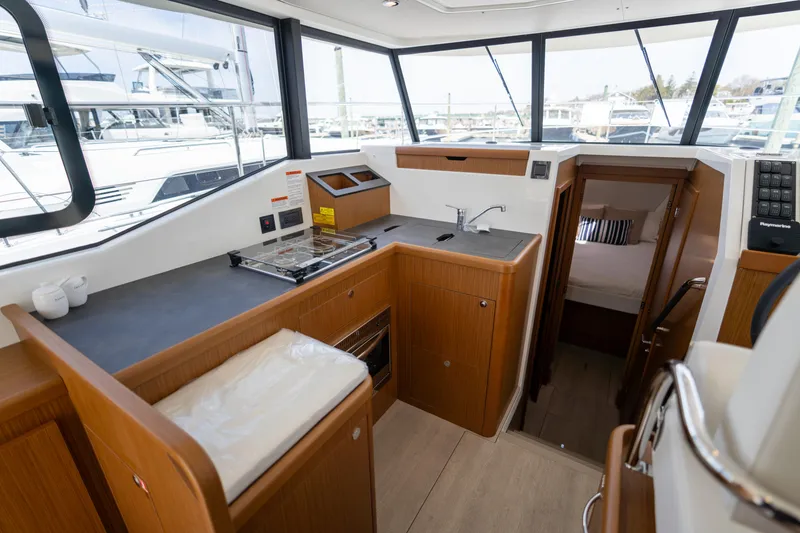 Slide: The Image of Interior of 2023 Beneteau Swift Trawler 35, featuring modern kitchen and cozy cabin. - 7