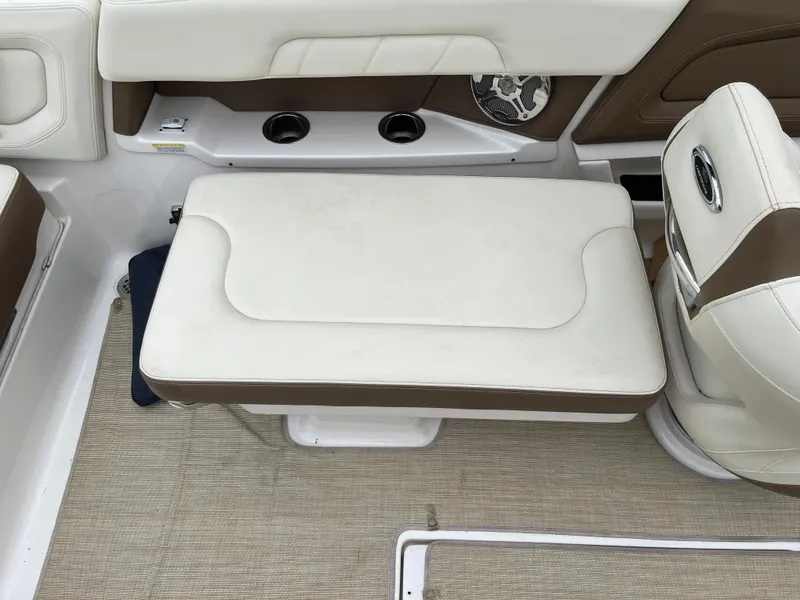 Slide: The Image of 2014 Chaparral 257 SSX boat interior with white and brown seating. - 10