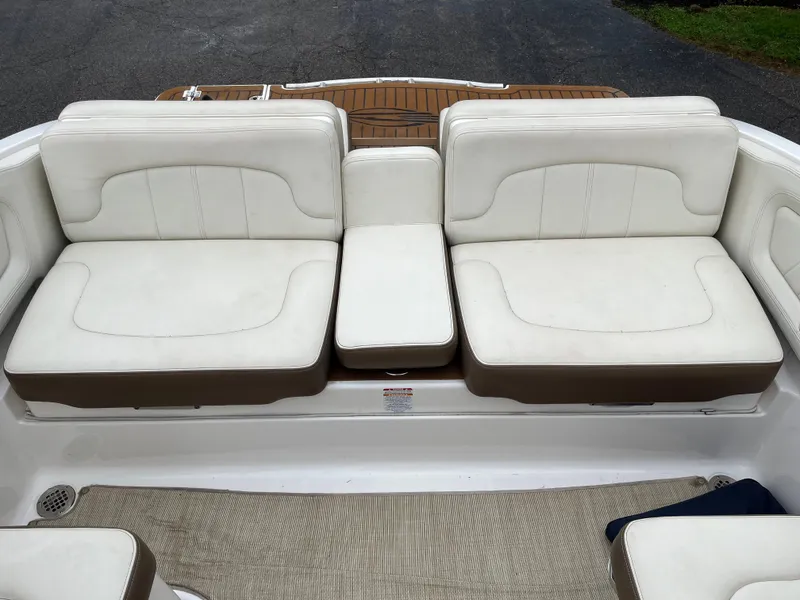 Slide: The Image of 2014 Chaparral 257 SSX boat interior with white leather seating. - 12
