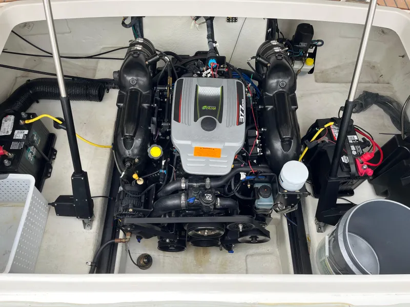Slide: The Image of Engine compartment of a 2014 Chaparral 257 SSX boat, showcasing detailed components. - 14
