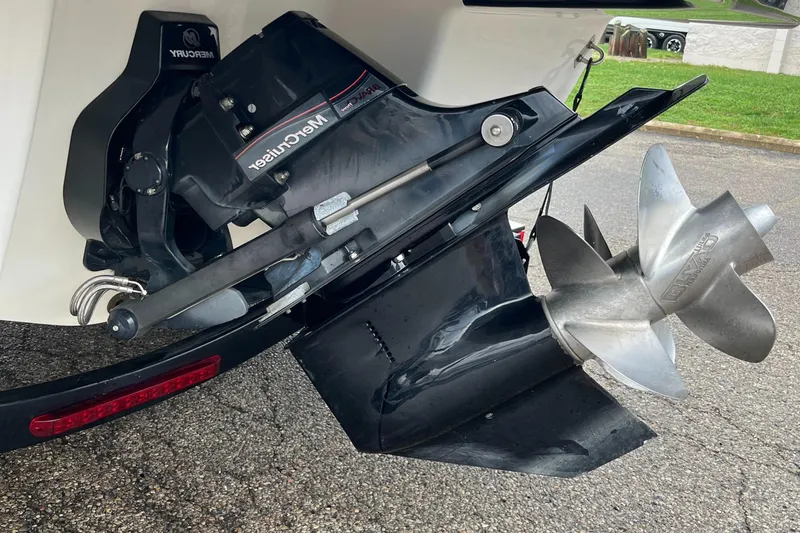 Slide: The Image of Close-up of 2014 Chaparral 257 SSX boat's MerCruiser outdrive and propeller. - 17