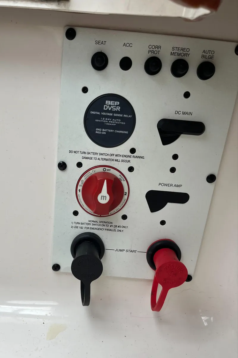 Slide: The Image of Control panel of a 2014 Chaparral 257 SSX boat with switches and dials. - 18