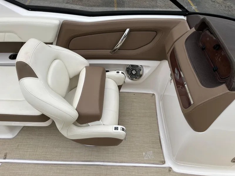 Slide: The Image of 2014 Chaparral 257 SSX boat interior with beige and white seating. - 9
