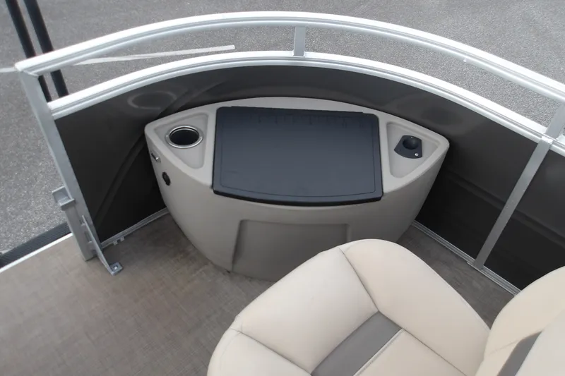 Slide: The Image of 2025 Sun Tracker Fishin' Barge 22 XP3 interior with seating and control panel. - 15