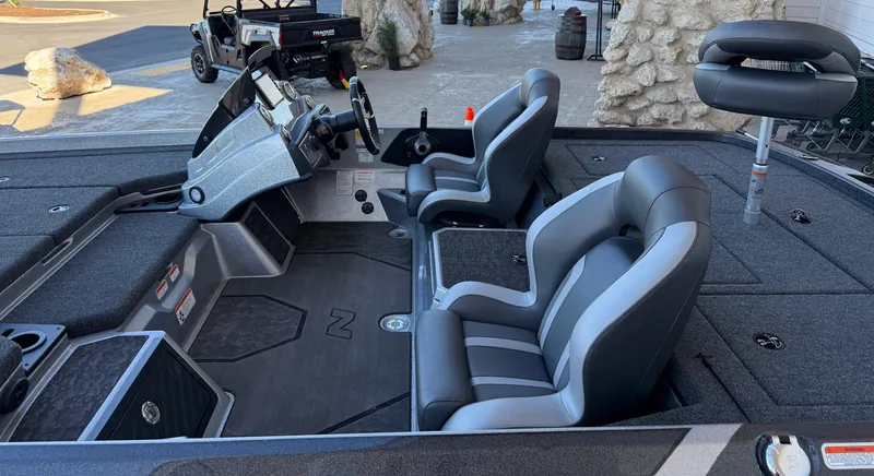 Slide: The Image of 2025 Nitro Z21 XL boat interior with dual seats and steering console. - 3