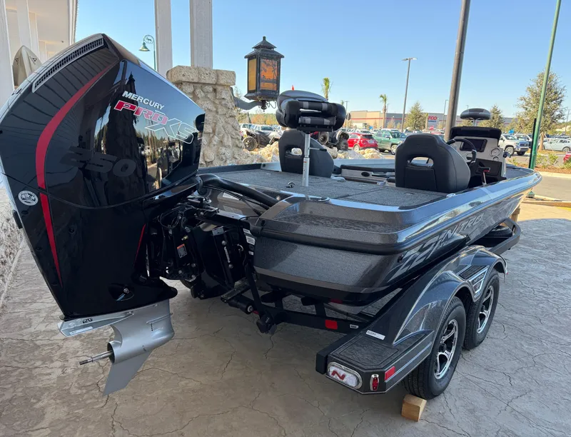 Slide: The Image of 2025 Nitro Z21 XL boat with Mercury Pro XS engine, parked on a trailer. - 4