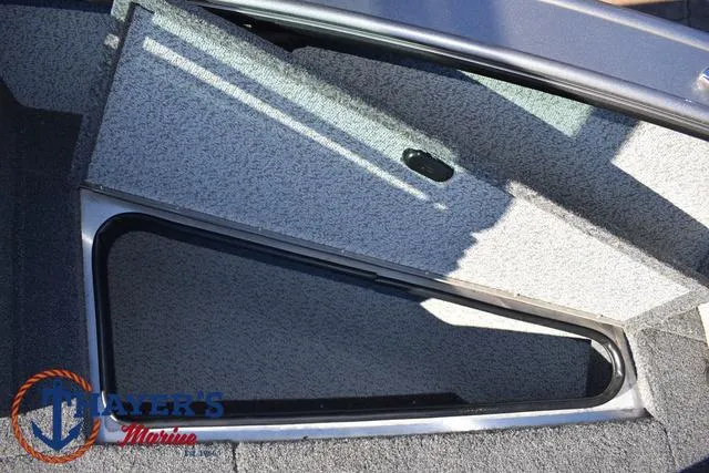 Slide: The Image of 2023 Lund 1875 Fisherman Sport boat storage compartment, open lid, interior view. - 12