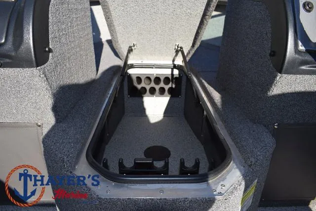 Slide: The Image of 2023 Lund 1875 Fisherman Sport boat storage compartment with rod holders. - 14