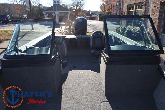 Slide: The Image of 2023 Lund 1875 Fisherman Sport boat interior with dual consoles and seating. - 15