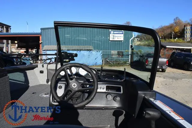 Slide: The Image of 2023 Lund 1875 Fisherman Sport boat dashboard at Thayer's Marine dealership. - 19