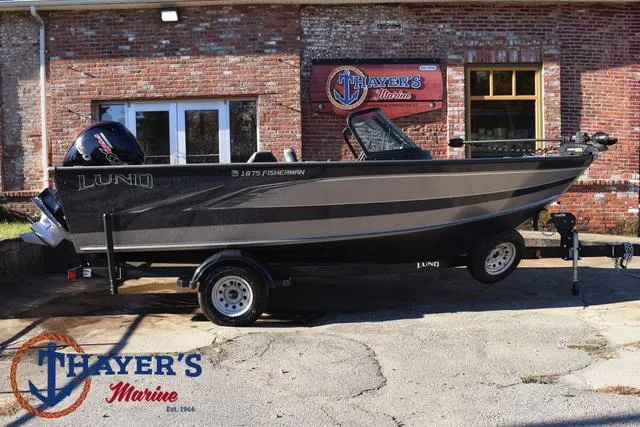 Slide: The Image of 2023 Lund 1875 Fisherman Sport boat on trailer at Thayer's Marine. - 2