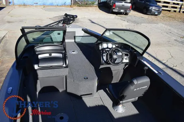 Slide: The Image of 2023 Lund 1875 Fisherman Sport boat interior with steering console and seating. - 29