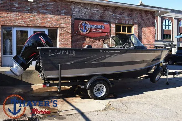 Slide: The Image of 2023 Lund 1875 Fisherman Sport boat on trailer outside Thayer's Marine. - 3
