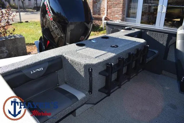 Slide: The Image of 2023 Lund 1875 Fisherman Sport boat interior with motor and seating. - 30