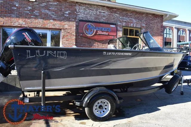 Slide: The Image of 2023 Lund 1875 Fisherman Sport boat on trailer outside Thayer's Marine. - 34