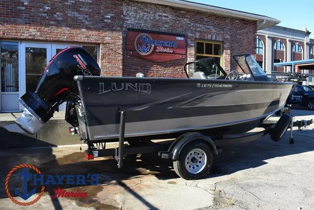 Slide: The Image of 2023 Lund 1875 Fisherman Sport boat displayed at Thayer's Marine dealership. - 35