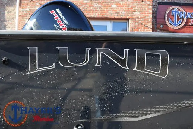 Slide: The Image of 2023 Lund 1875 Fisherman Sport boat with Mercury Pro motor, Thayer's Marine logo. - 4