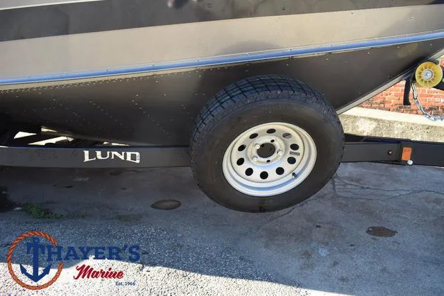 Slide: The Image of 2023 Lund 1875 Fisherman Sport trailer with Thayer's Marine branding. - 7