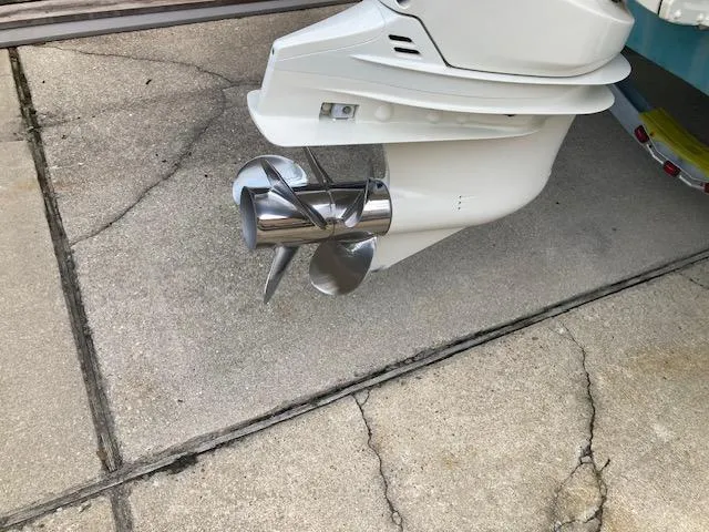 Slide: The Image of 2006 Hurricane SunDeck 237 OB boat propeller on concrete surface. - 4