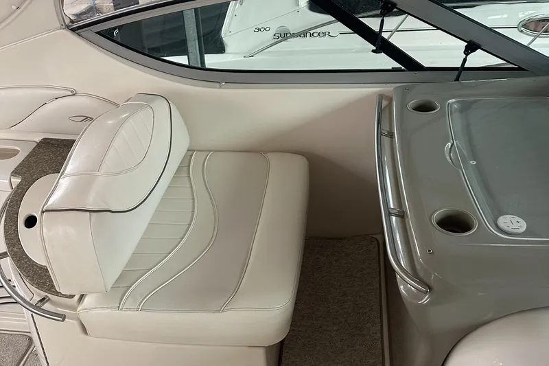 Slide: The Image of Interior of 1998 Maxum 3700 SCR boat with white seating and console. - 22