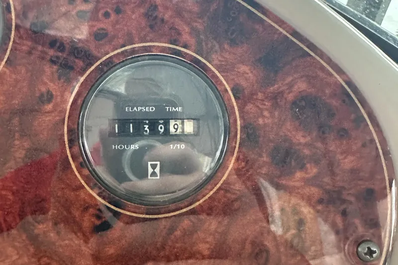 Slide: The Image of Hour meter showing 1139.9 hours on 1998 Maxum 3700 SCR boat dashboard. - 25