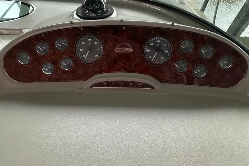 Slide: The Image of Dashboard of 1998 Maxum 3700 SCR boat with gauges and compass. - 26