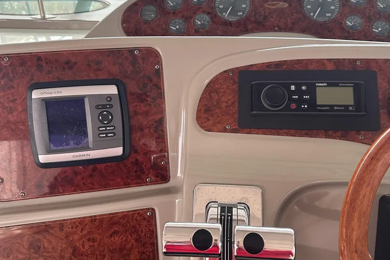 Slide: The Image of 1998 Maxum 3700 SCR dashboard with Garmin GPS and control panel. - 27