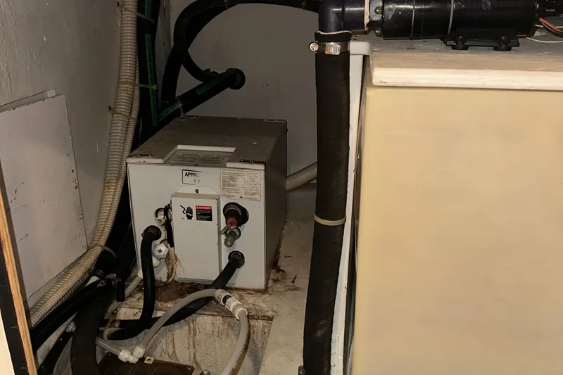 Slide: The Image of 1998 Maxum 3700 SCR engine compartment with wiring and components. - 32