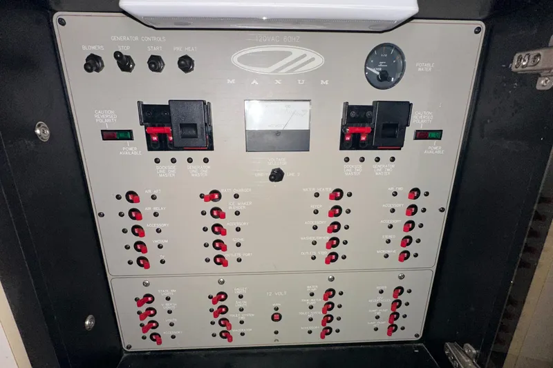 Slide: The Image of Maxum 3700 SCR 1998 electrical control panel with switches and indicators. - 34