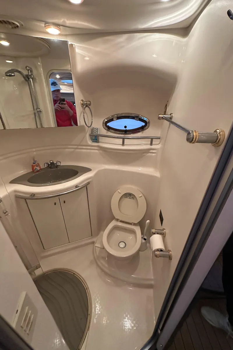 Slide: The Image of 1998 Maxum 3700 SCR yacht bathroom with sink, toilet, and shower. - 35