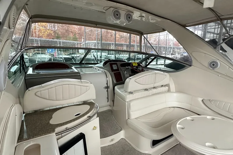 Slide: The Image of 1998 Maxum 3700 SCR yacht interior with seating and helm. - 45