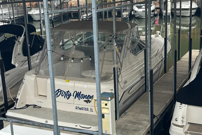 Slide: The Image of 1998 Maxum 3700 SCR boat docked in marina, rear view. - 47