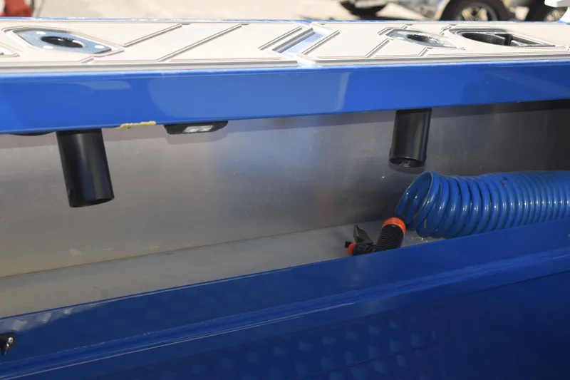 Slide: The Image of 2024 Stabicraft 1850 Fisher Sportfish interior detail with blue tubing and rod holders. - 11