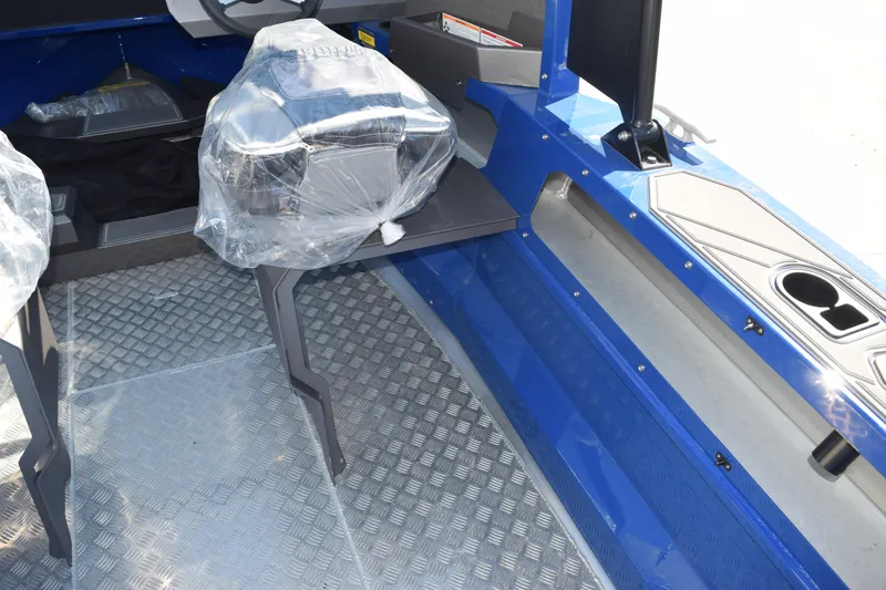 Slide: The Image of 2024 Stabicraft 1850 Fisher Sportfish interior with blue accents and seating. - 15