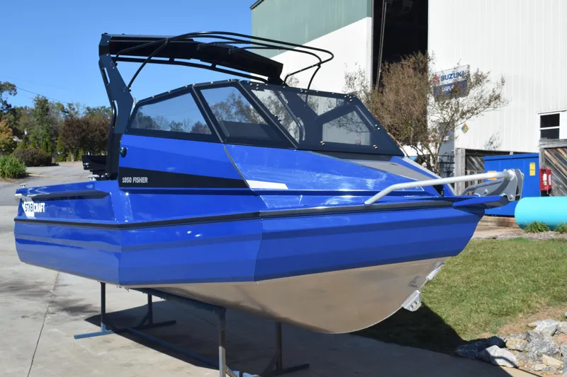 Slide: The Image of 2024 Stabicraft 1850 Fisher Sportfish boat in vibrant blue, displayed outdoors. - 3