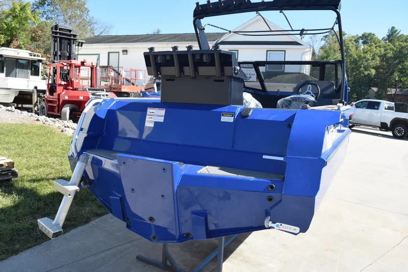 Slide: The Image of 2024 Stabicraft 1850 Fisher Sportfish boat, blue exterior, parked outdoors. - 4