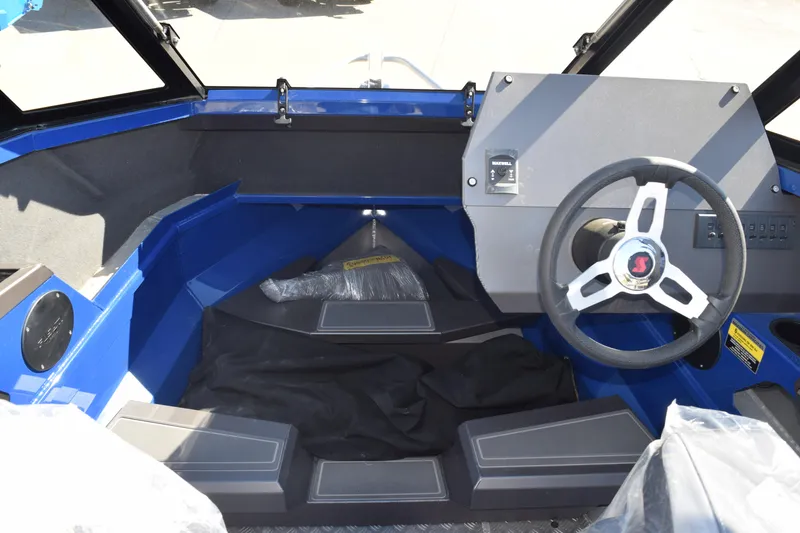 Slide: The Image of 2024 Stabicraft 1850 Fisher Sportfish interior with steering wheel and dashboard. - 6