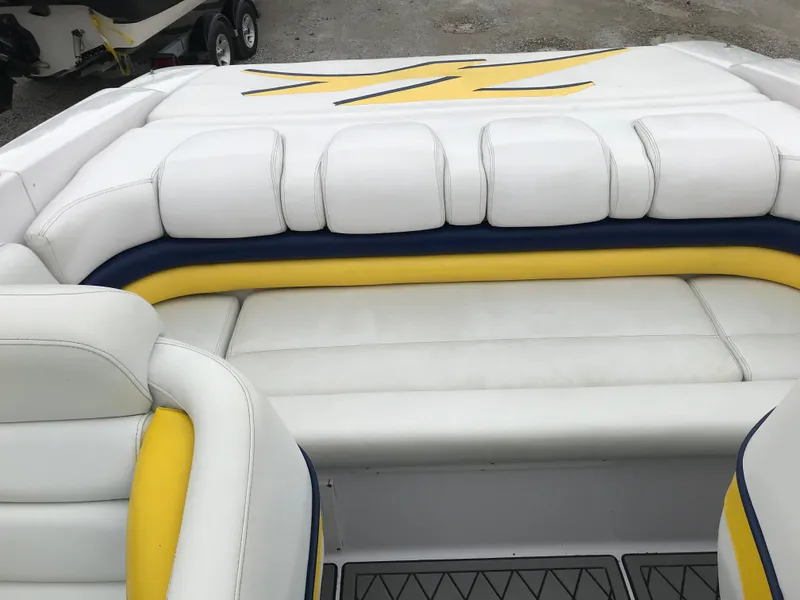 Slide: The Image of 2007 Donzi 28 ZX Open boat interior with white and yellow seating. - 10