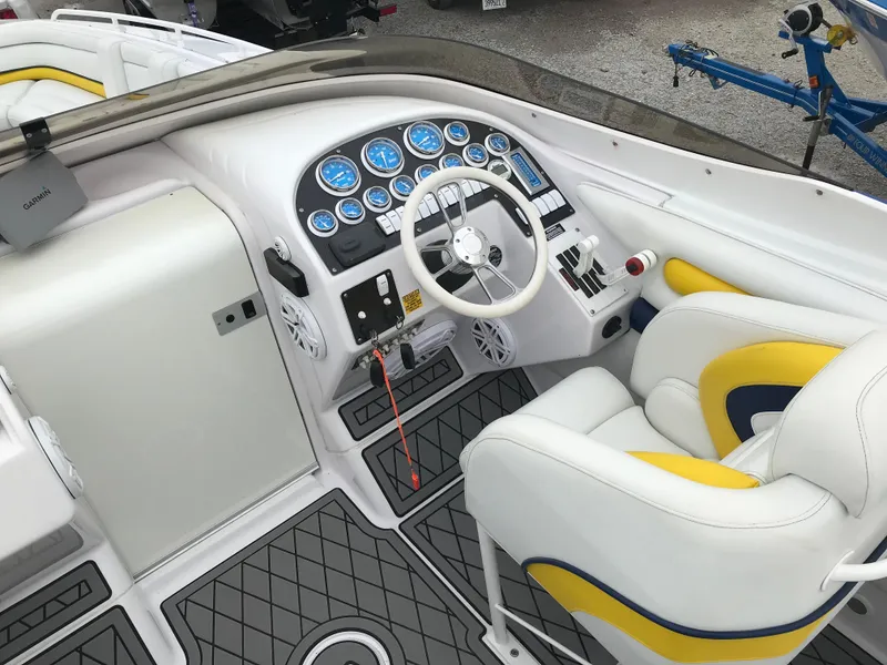 Slide: The Image of 2007 Donzi 28 ZX Open boat cockpit with white and yellow seating, modern dashboard. - 11