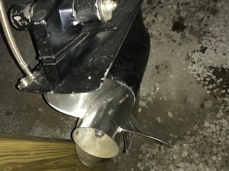 Slide: The Image of Propeller of a 2007 Donzi 28 ZX Open boat on gravel surface. - 14