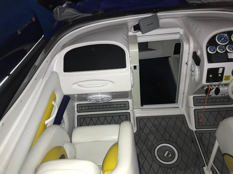 Slide: The Image of 2007 Donzi 28 ZX Open boat interior with white and yellow seating, dashboard, and controls. - 22