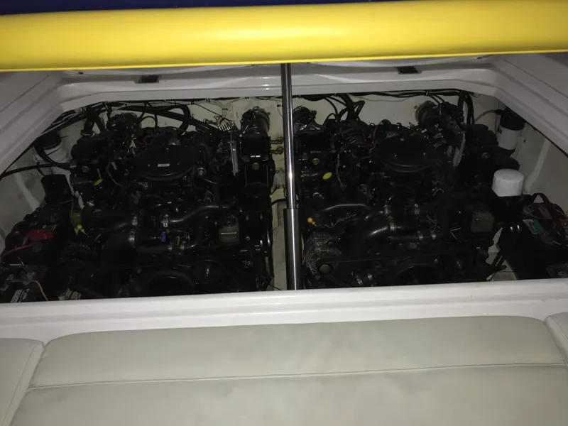 Slide: The Image of 2007 Donzi 28 ZX Open boat engine compartment with dual engines visible. - 23