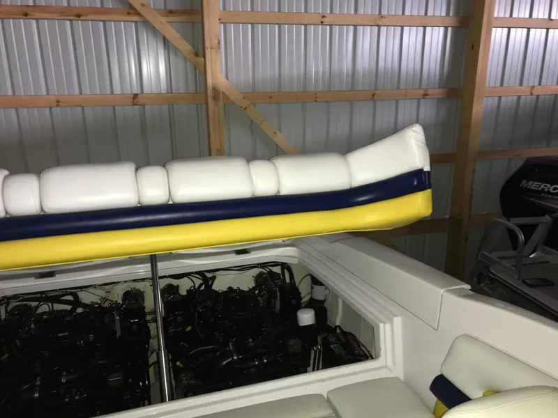 Slide: The Image of 2007 Donzi 28 ZX Open boat interior with engine compartment, stored in a metal shed. - 24