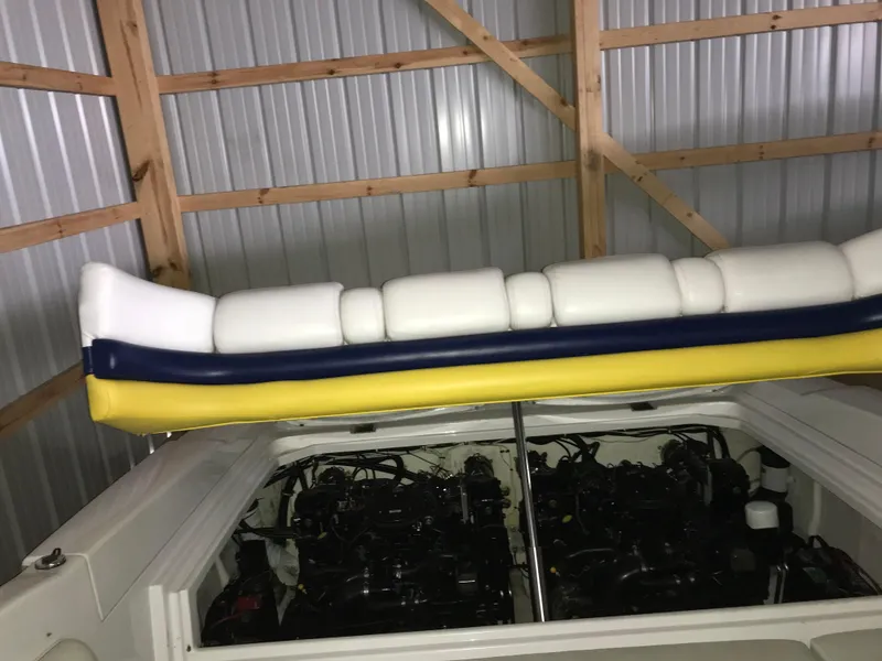 Slide: The Image of 2007 Donzi 28 ZX Open boat engine compartment in a wooden shed. - 25
